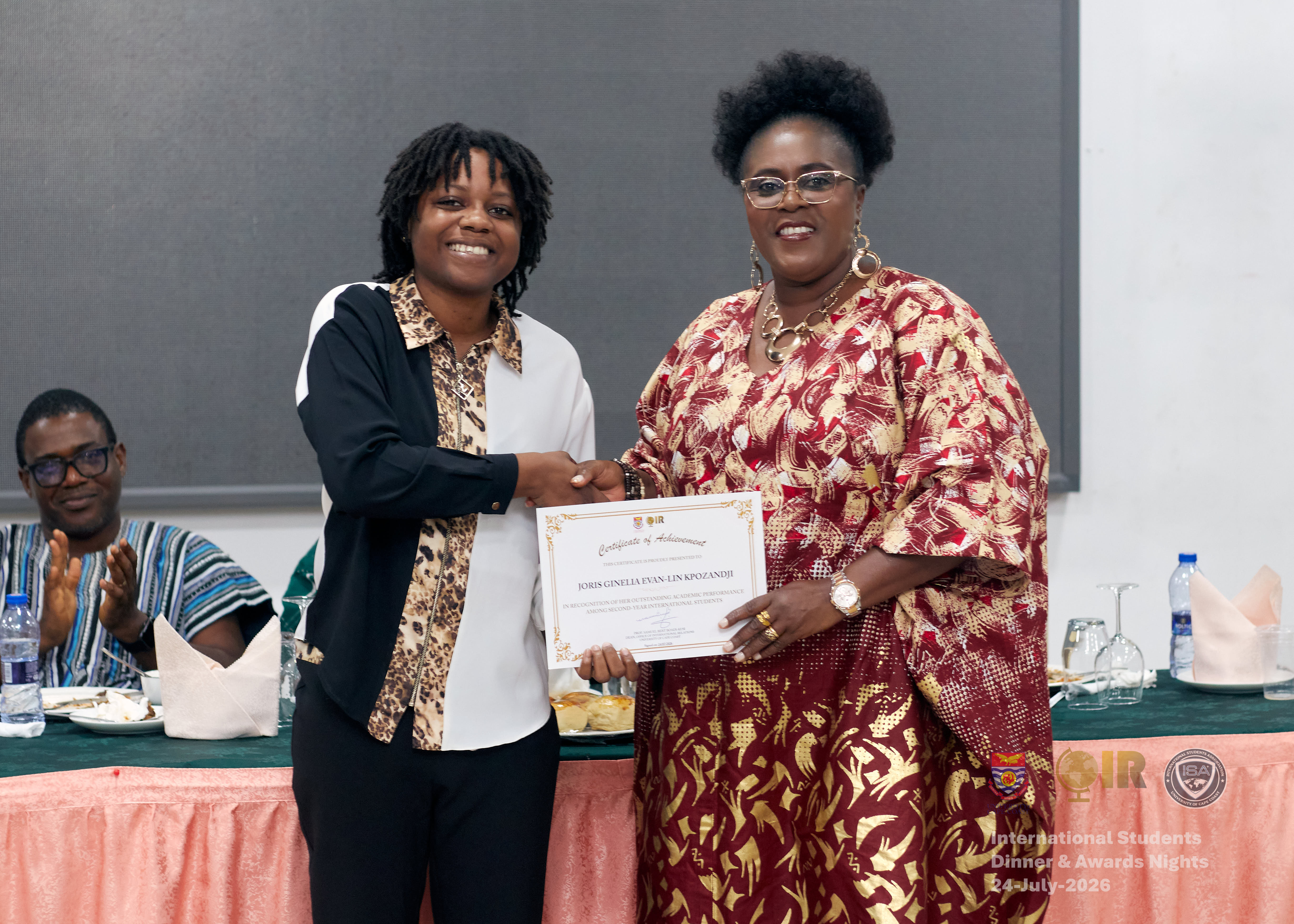 Student being presented with an award by Prof Obiri-Yeboah