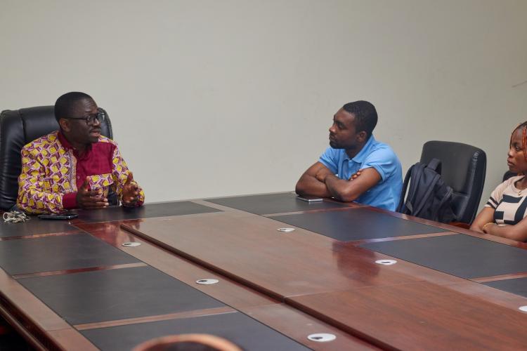Dean speaking with students